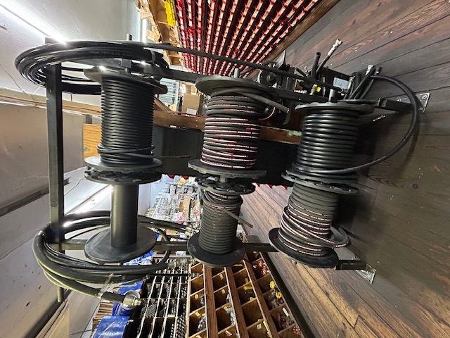 Bulk industrial hose reels with black rubber hoses